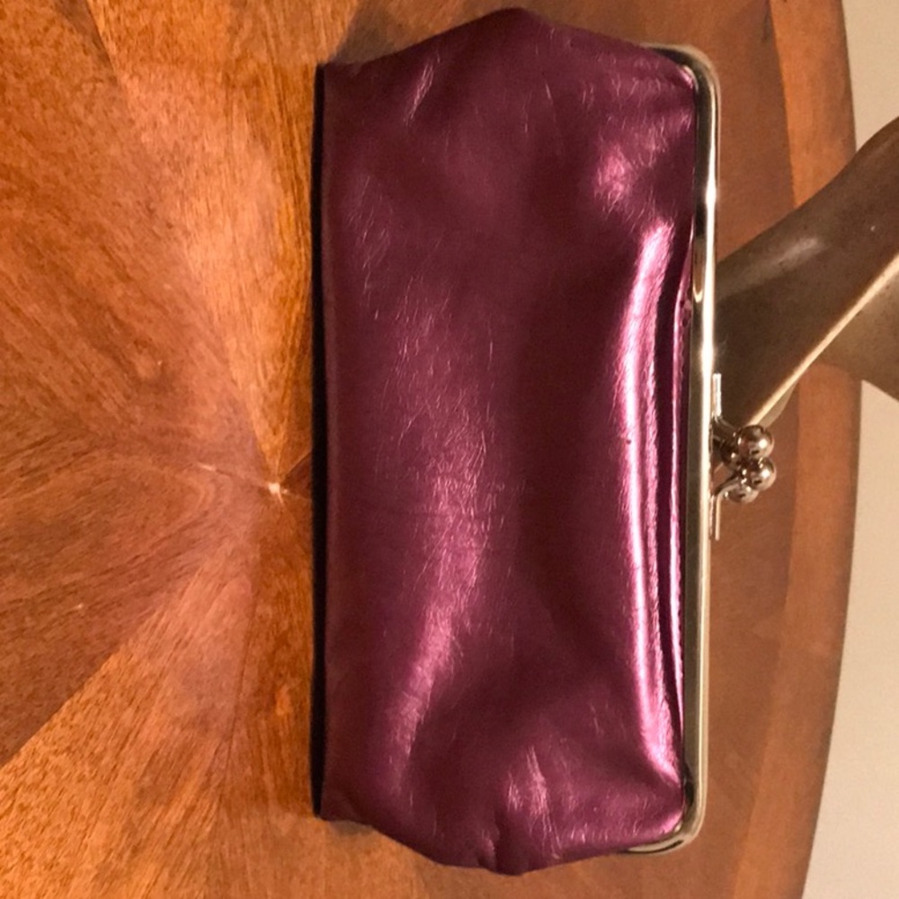 Purple clutch has many pockets